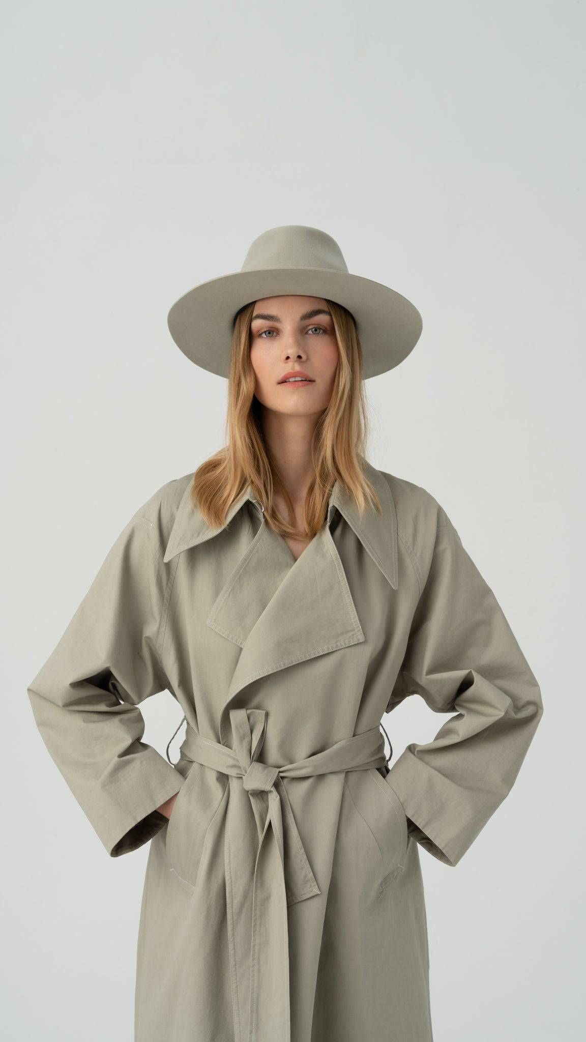 Front view of the Monogram-embellished fedora hat, styled with a structured brim and a refined grey ribbon for a high-fashion statement.