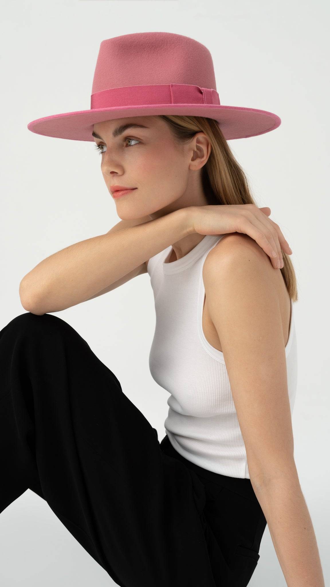 Monogram Fedora Hat in dusty pink, handcrafted from rabbit fur felt with a bow ribbon detail. A stylish and elegant accessory for timeless fashion.