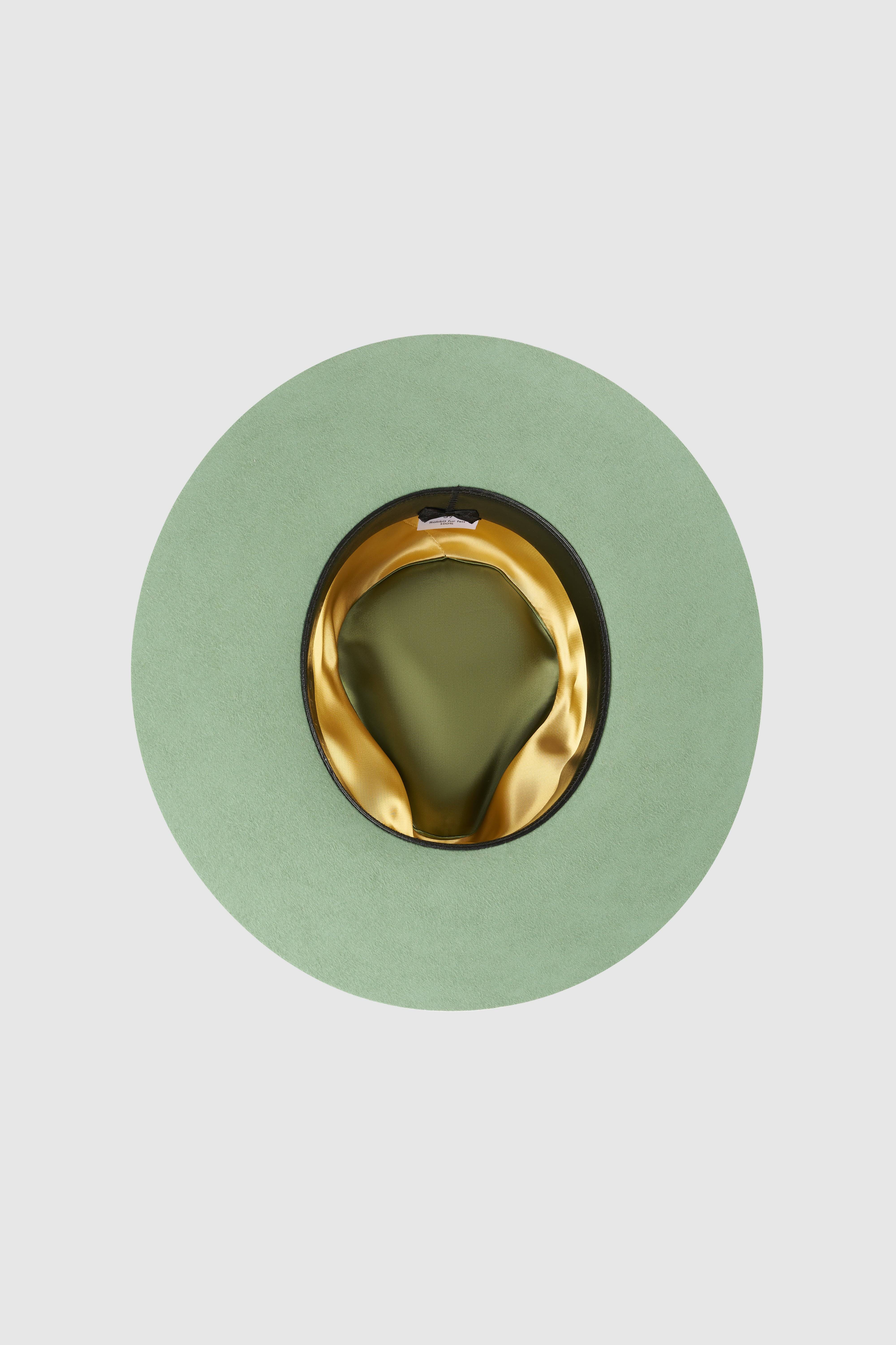 Interior view of Borisetti green fedora hat with gold lining. A luxury handcrafted rabbit fur felt fedora with premium millinery details.