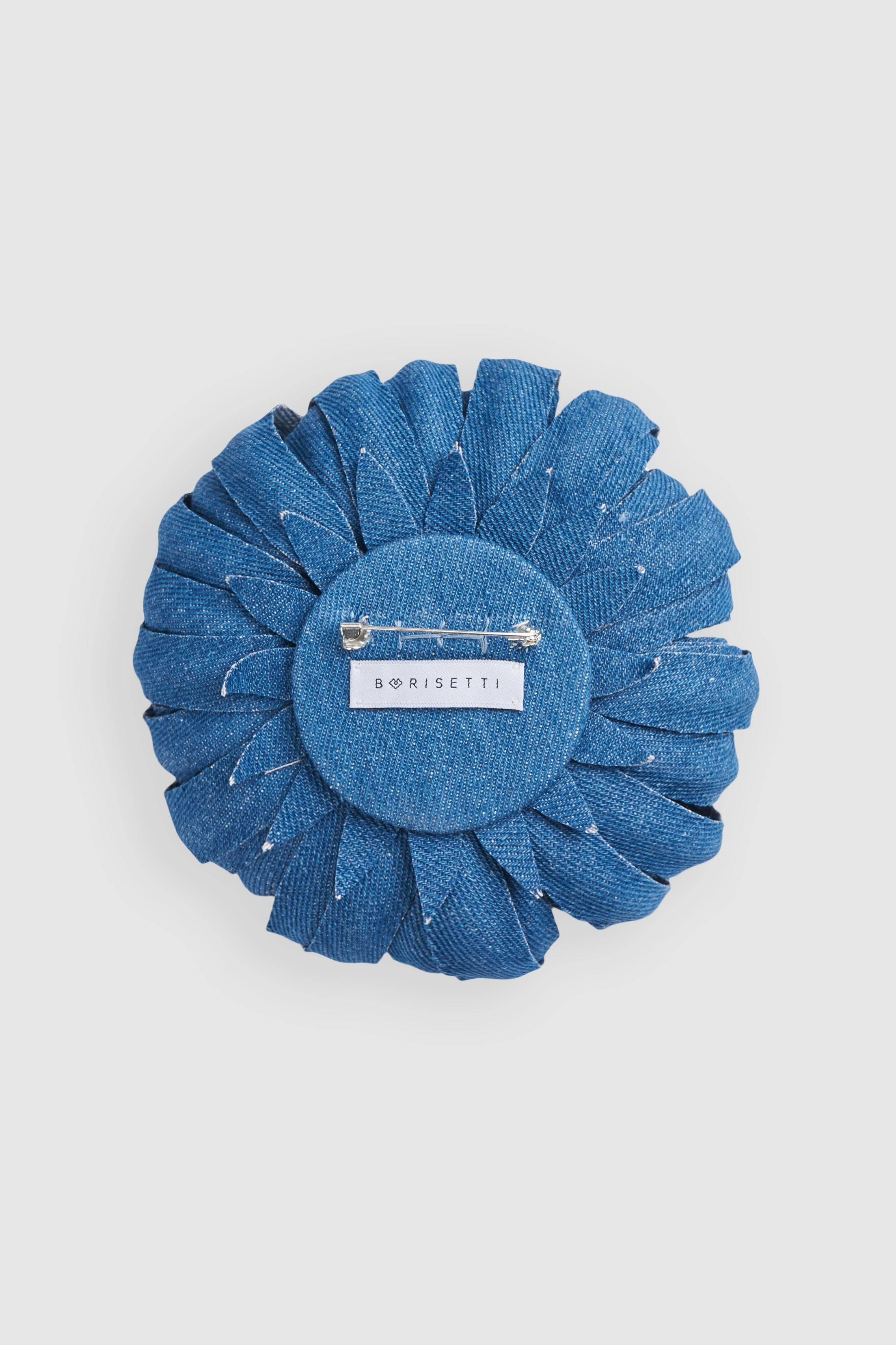 Back view of Borisetti Denim Flower Brooch featuring a secure pin clasp and branded label. A stylish handcrafted denim lapel pin.