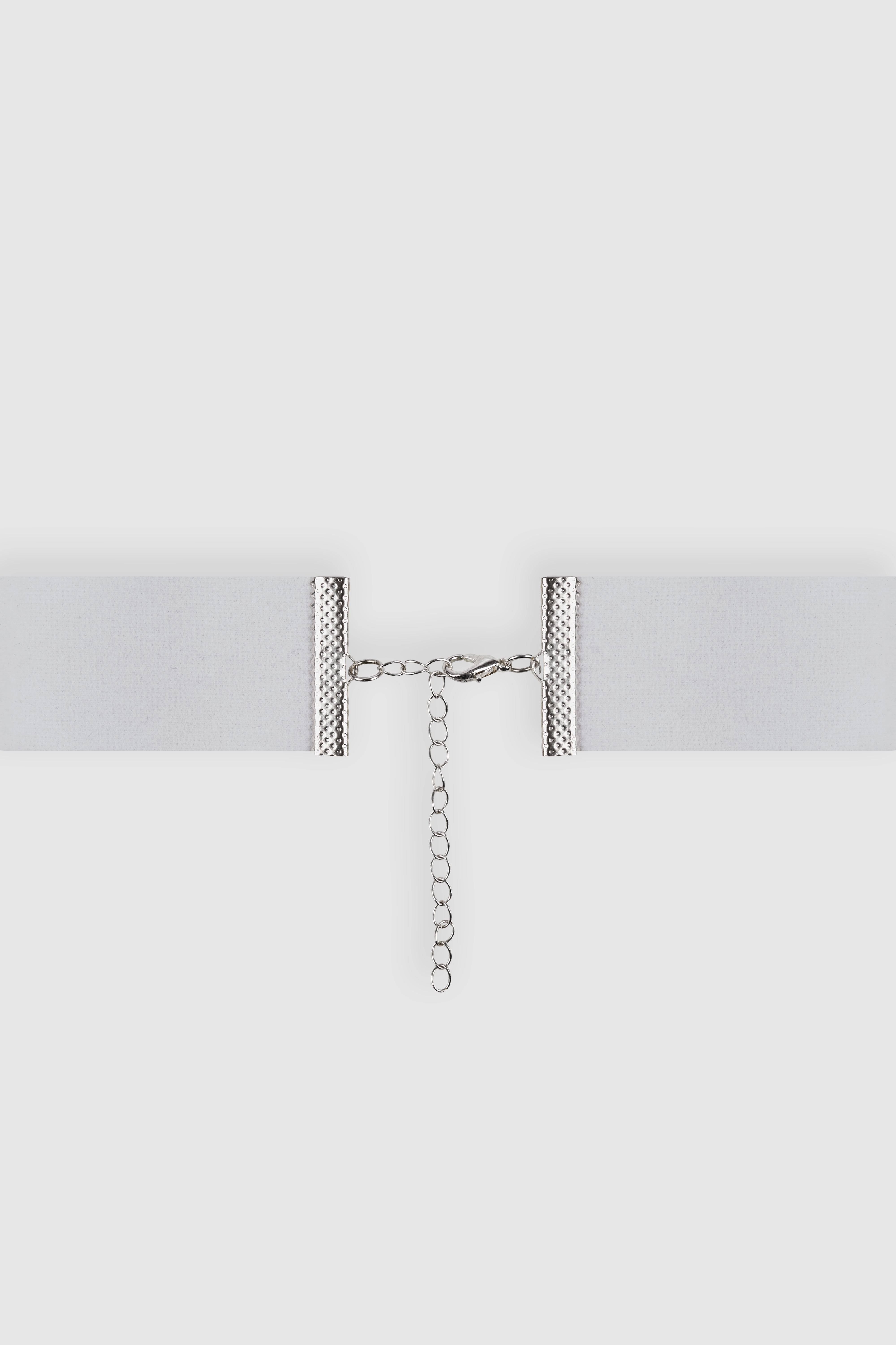 Adjustable white choker with silver clasp and chain closure. Designed to complement the silk peony brooch for a refined, elegant look.