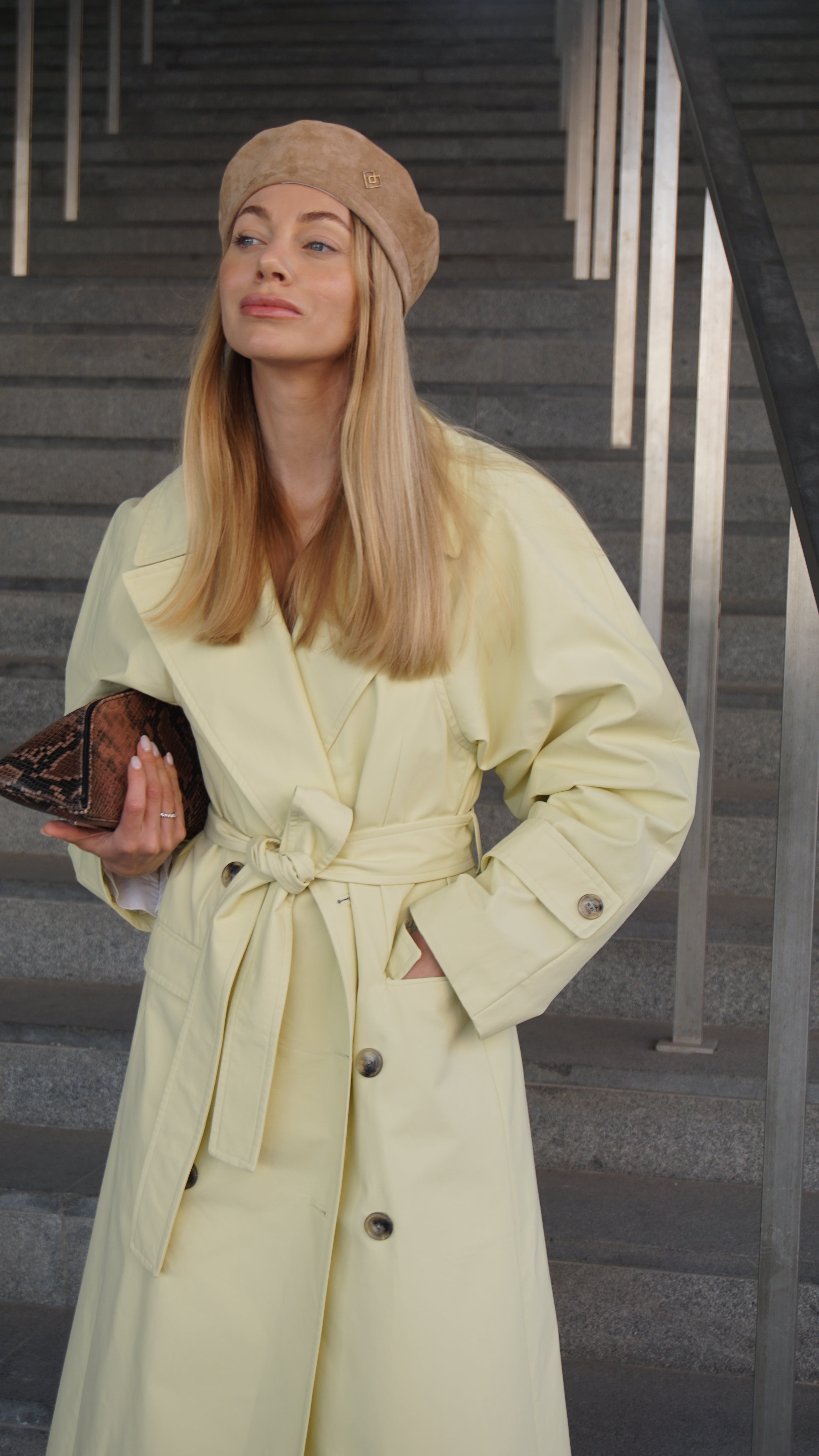 Light brown suede leather beret styled with a chic yellow trench coat. Elevate your fashion with this handcrafted beret, perfect for a modern look.