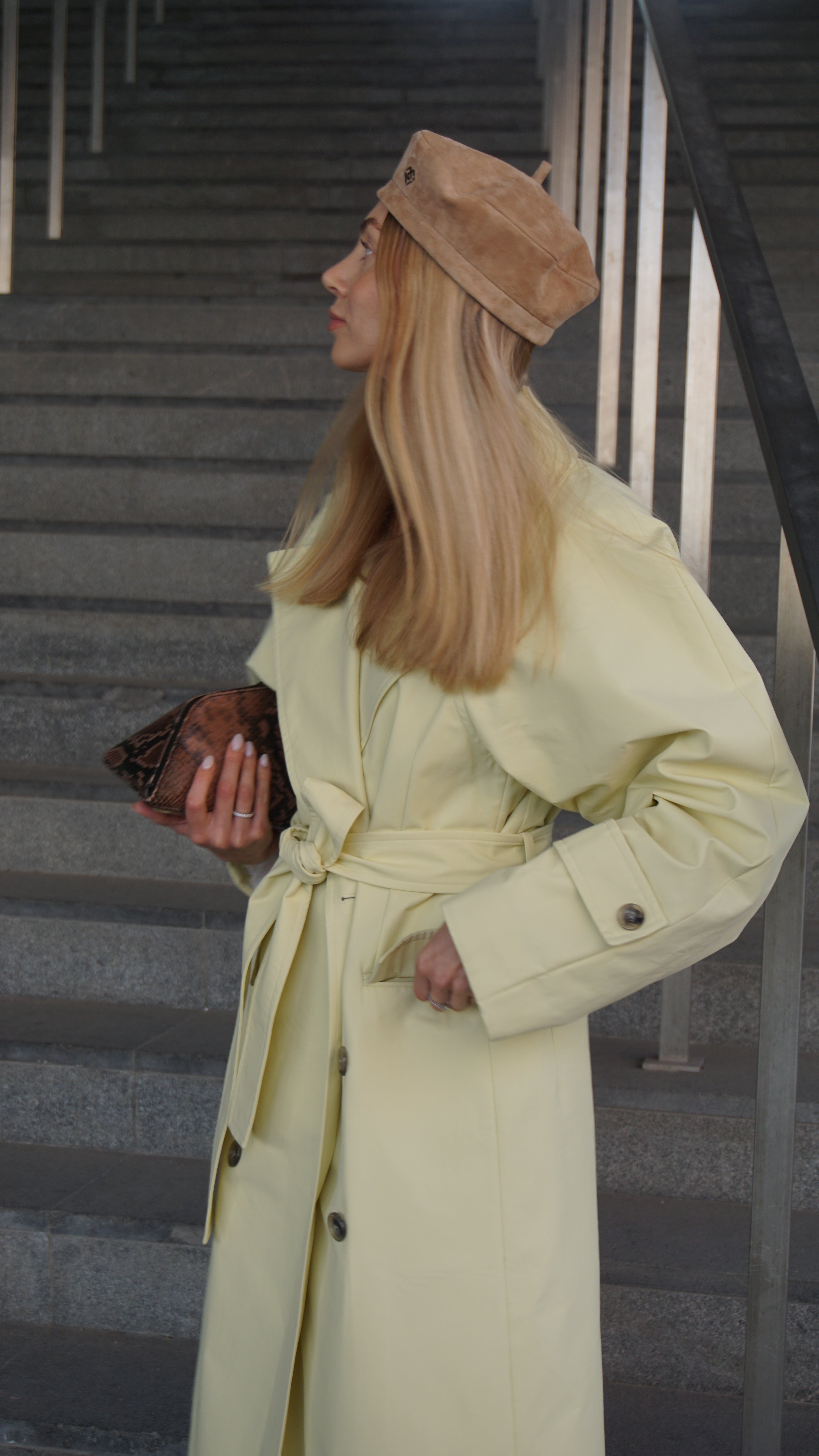 Light brown suede leather beret styled with a chic beige trench coat. Elevate your fashion with this handcrafted beret, perfect for a Parisian-inspired look.