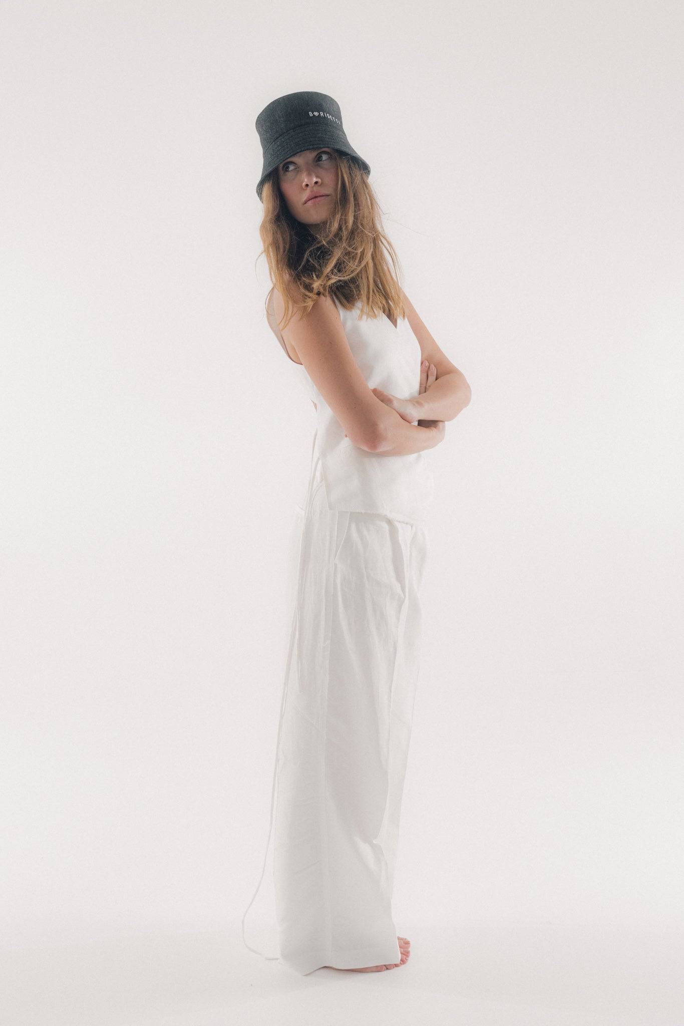 Elegant black denim bucket hat with Borisetti branding, paired with a white ensemble. Crafted from 100% cotton for comfort and style.