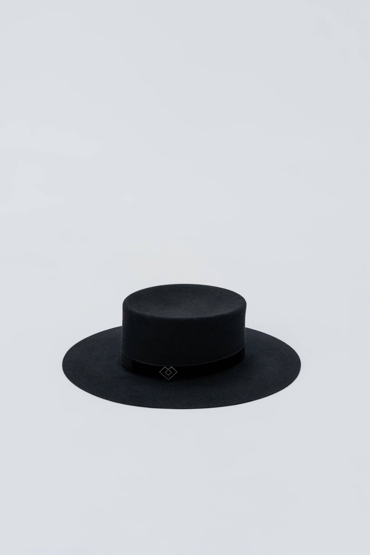 Luxury black boater hat with monogram embellishment, crafted from rabbit fur. A custom handmade couture piece with a timeless and elegant appeal.