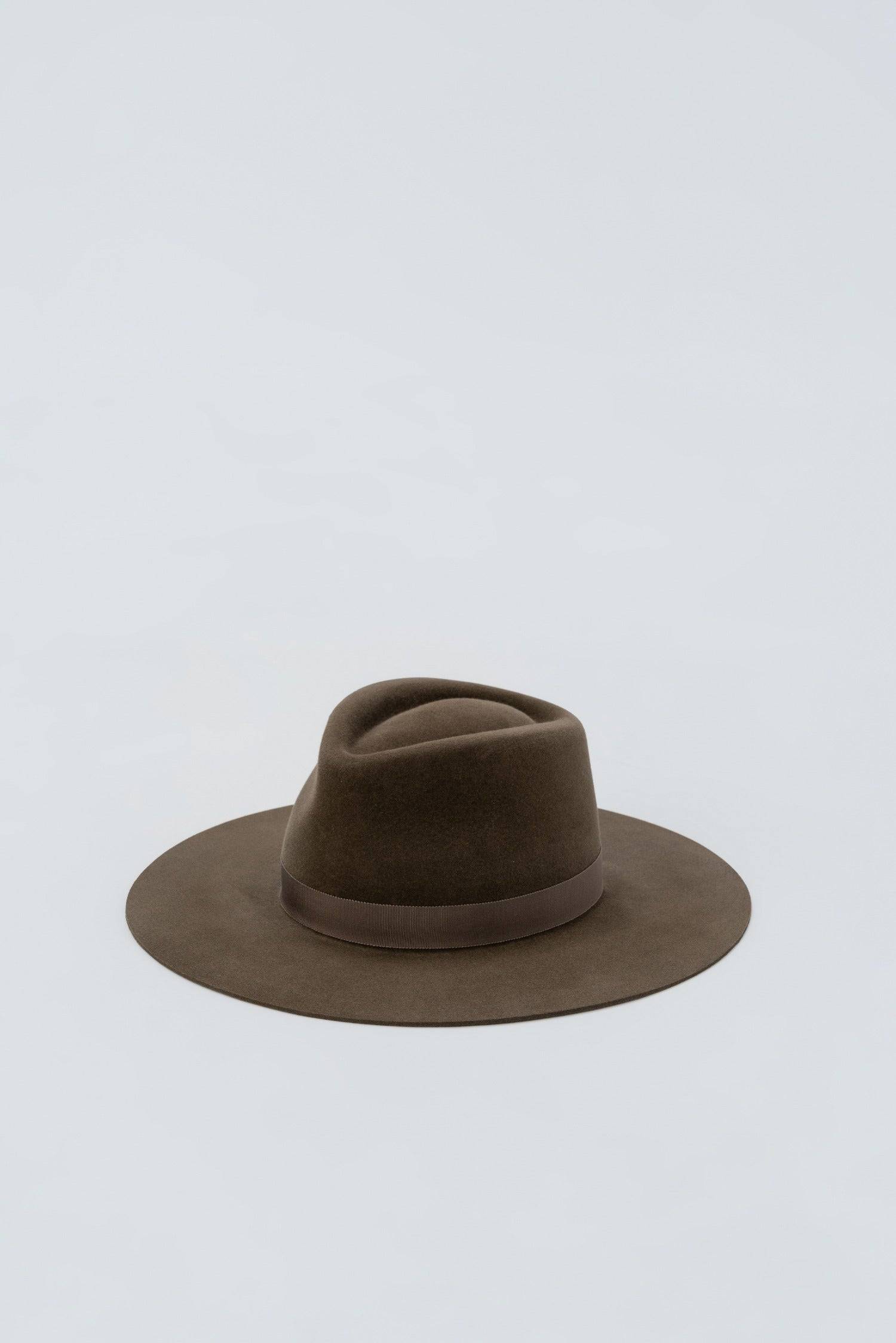 Custom-made brown fedora hat with a structured crown and suede finish. A premium millinery piece designed for both casual and formal occasions.