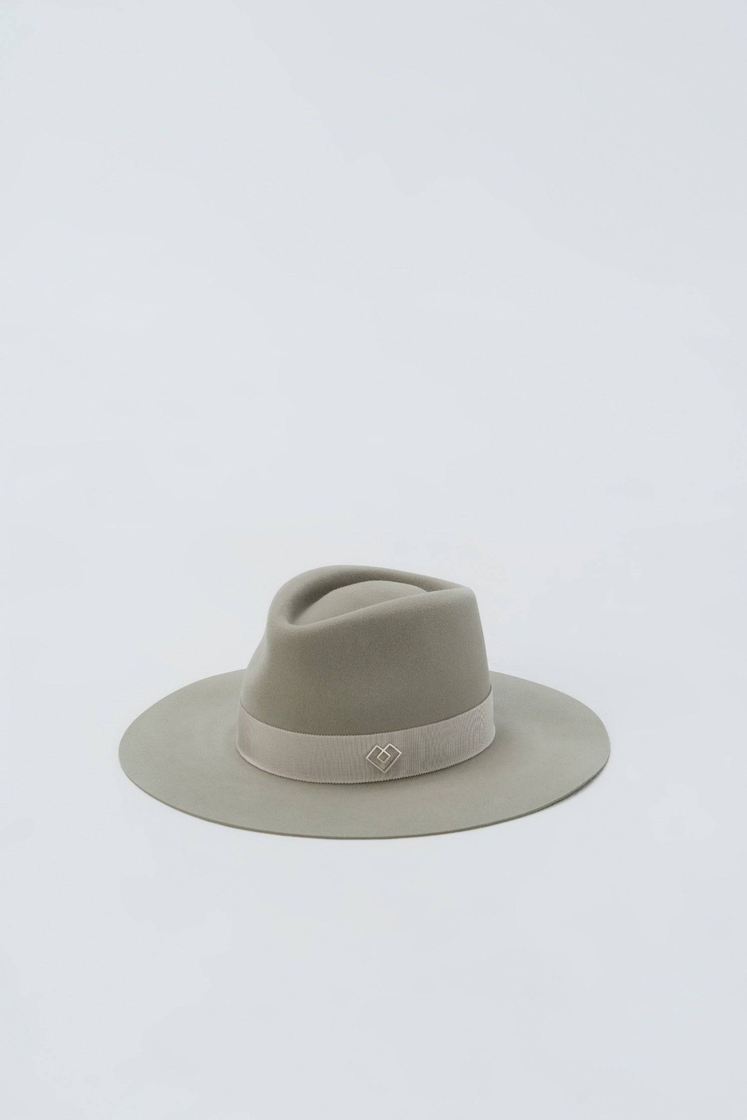 Close-up of the Monogram-embellished fedora hat, featuring a handcrafted rabbit fur felt body, grey Petersham ribbon, and Borisetti Heart Monogram.